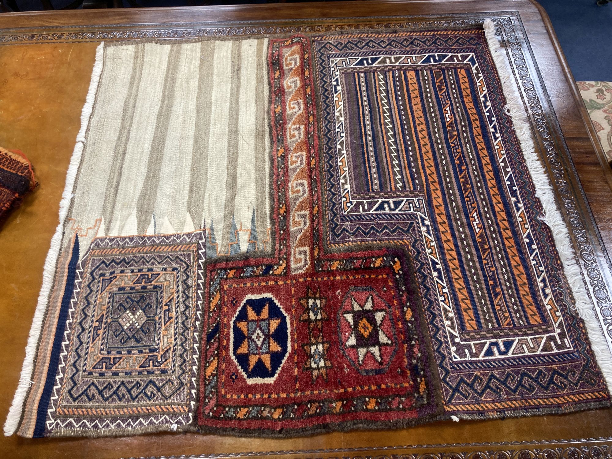 Six Caucasian / South West Persian mats and a saddlebag, largest 150 x 90cm